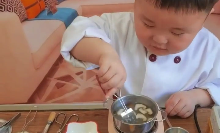 Little Chef Cooking in His Small Kitchen